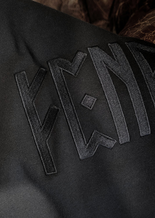 A premium embroidered Fenrir hoodie with a Scandinavian design inspired by Norse mythology. Made from premium materials and designed for maximum comfort and style. This Fenrir Embroidered Hoodie combines Viking culture with minimalist design. It uses black thread on a black hoodie to create something truly modern and special. If you want something unique and exciting for yourself or if you're looking for an amazing gift idea for the holidays, don't hesitate to pick up one (or several!) today.