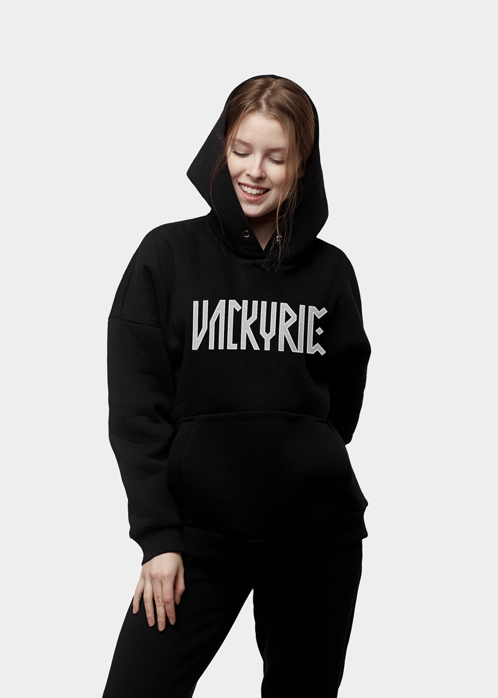 A premium embroidered Valkyrie hoodie with a Scandinavian design inspired by Norse mythology. Made from premium materials and designed for maximum comfort and style. This Valkyrie Embroidered Hoodie combines Viking culture with minimalist design. It uses black thread on a black hoodie to create something truly modern and special. If you want something unique and exciting for yourself or if you're looking for an amazing gift idea for the holidays, don't hesitate to pick up one (or several!) today.