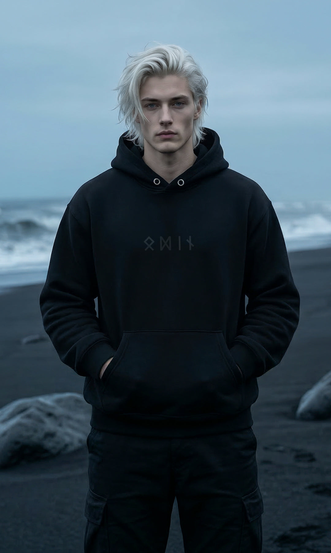 Black minimalist Odin hoodie featuring the name “Odin” spelled in Elder Futhark runes. Sleek Norse-inspired design, pullover style with adjustable hood and kangaroo pocket, subtle mythological vibe.